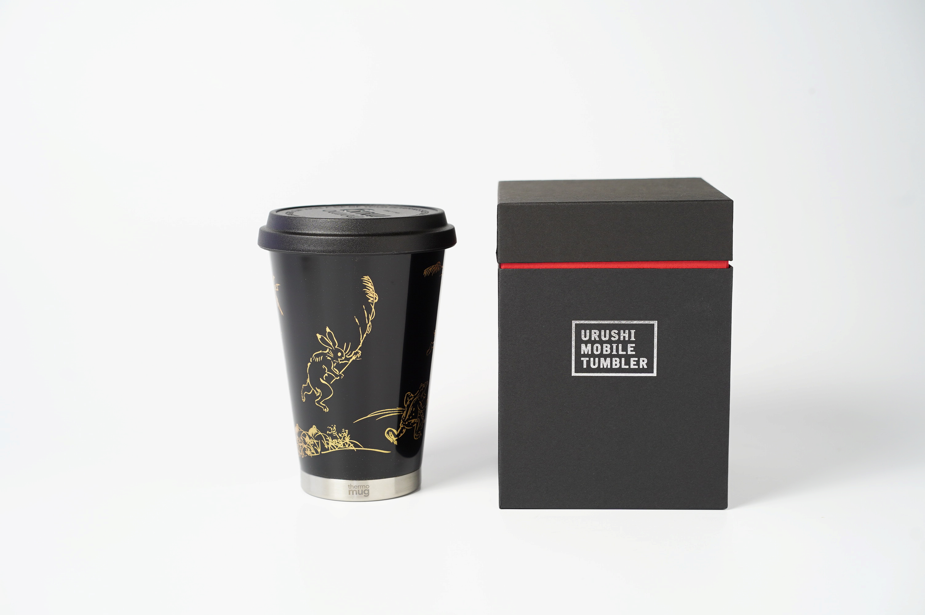 漆塗モバイルタンブラー　鳥獣戯画　黒　ギフト箱入り<p>日本の伝統工芸の一つ「漆」を使ったステンレスタンブラーです。街のカフェや職場やご家庭での午後の休息時間に…<p>記念品や珈琲好きの方へのプレゼントに最適です。